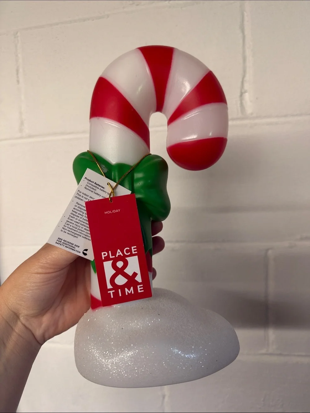 Red and White Candy Cane Ornament with Green Bow
